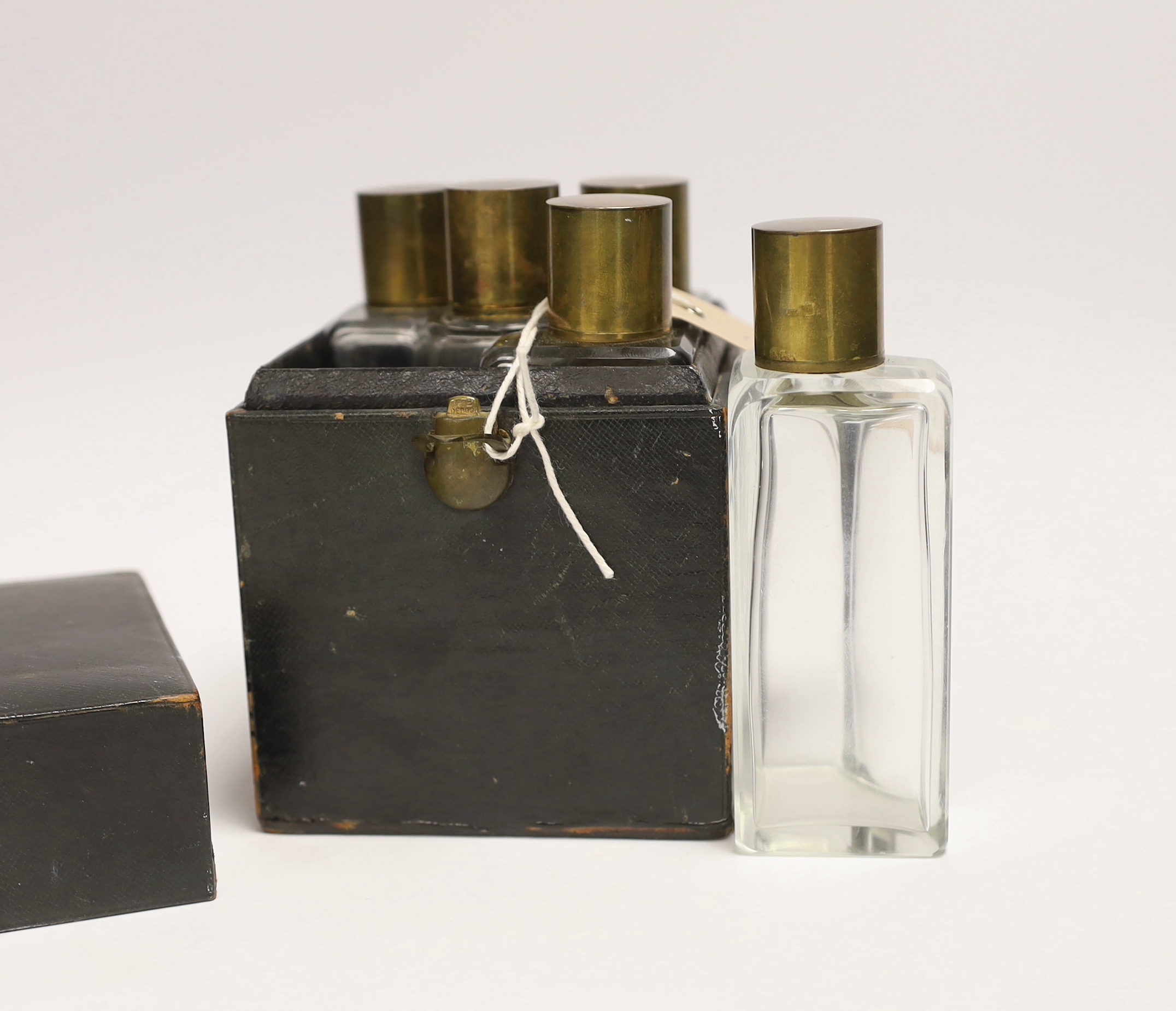 A Victorian set of scent bottles in leather travelling case